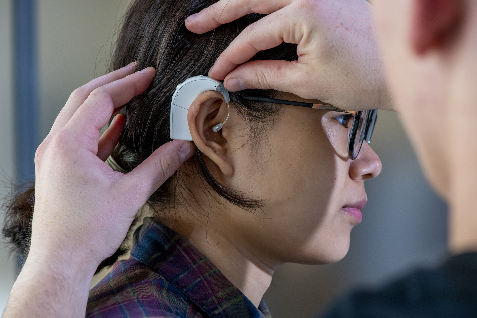 A person being fitted with a hearing aid