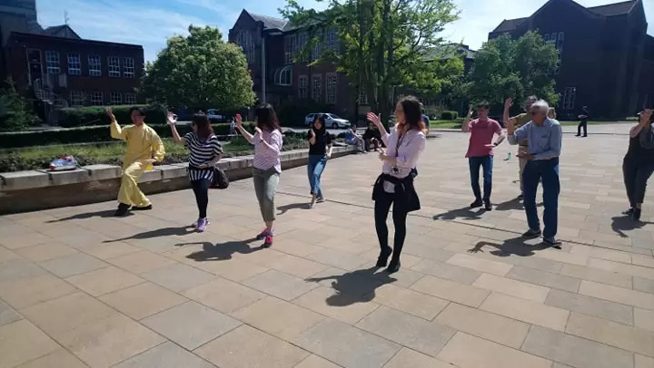 Members of ECS staff take part in a Tai Chi lesson